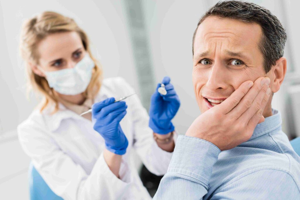 Patient with a toothache during an emergency dental visit.